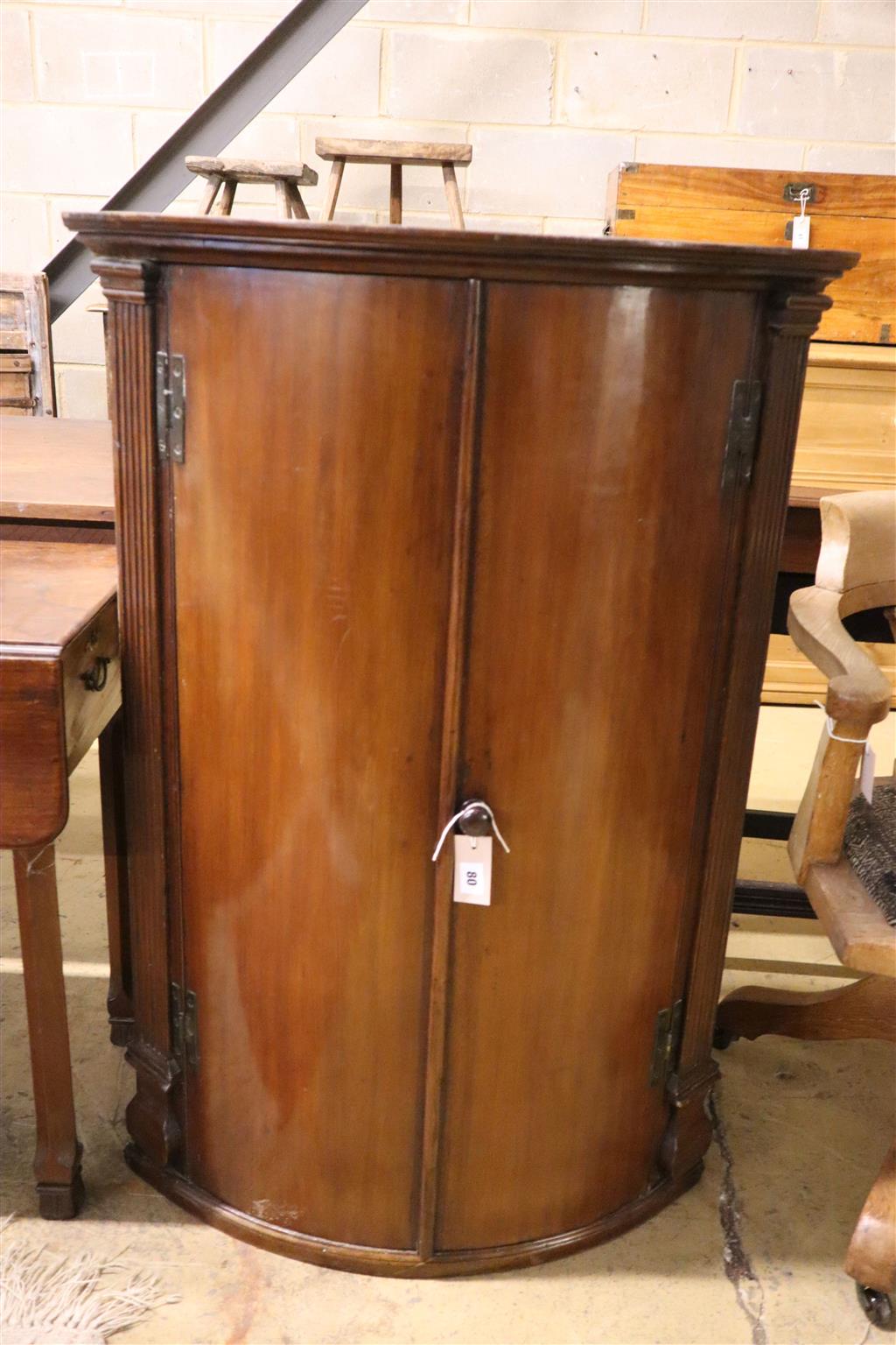 A George III mahogany bow front hanging corner cabinet, width 74cm, depth 48cm, height 108cm